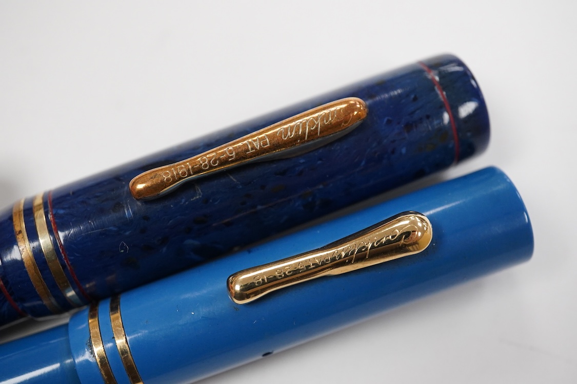 Two Conklin Enoura fountain pens in lapis blue (Senior) and a pale blue example